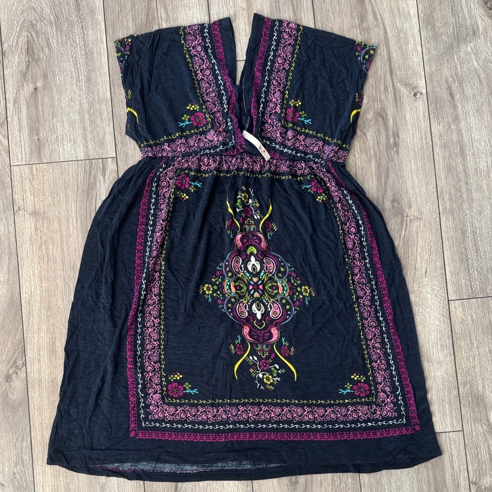 Kiwi Black Garment with‎ Pink and Yellow Accents